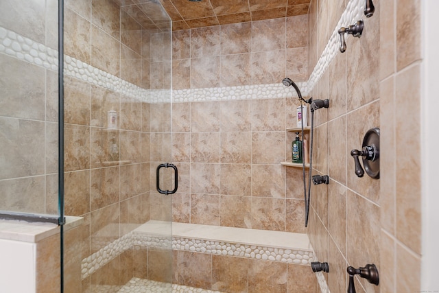 bathroom featuring an enclosed shower