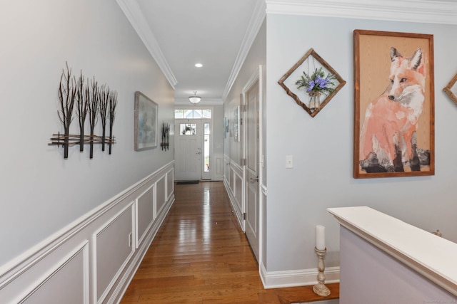 hallway featuring crown molding and hardwood / wood-style flooring