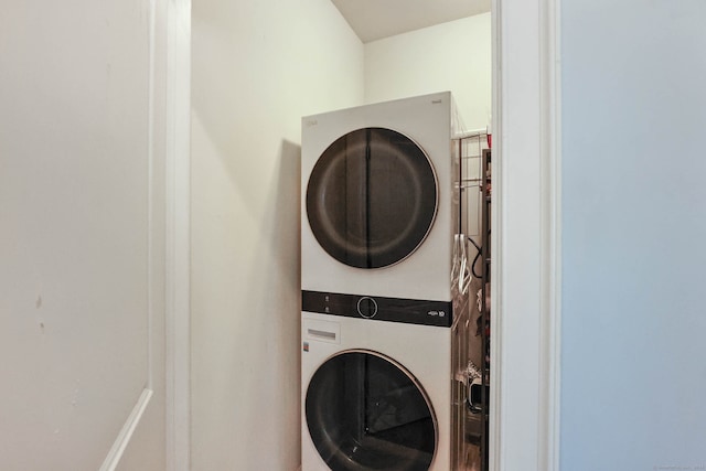 laundry area featuring stacked washer and dryer