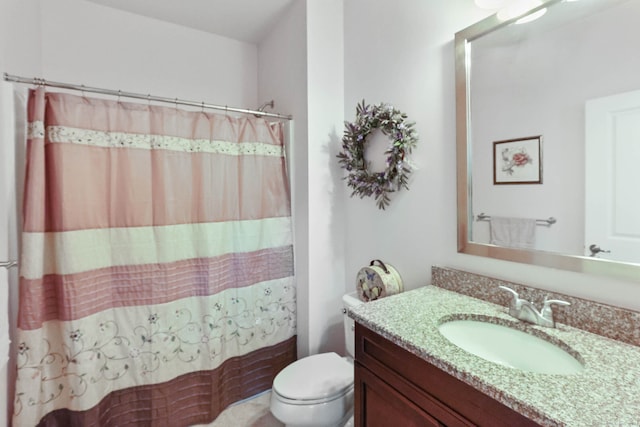 bathroom featuring a shower with curtain, vanity, and toilet