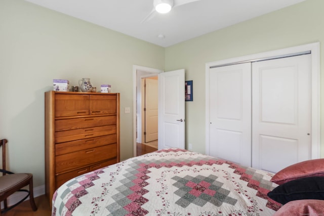 bedroom with ceiling fan and a closet