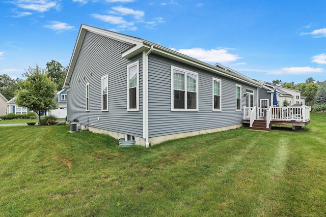 exterior space featuring a deck and a lawn