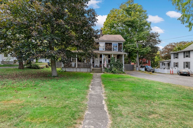 view of front of house featuring a front lawn and a porch