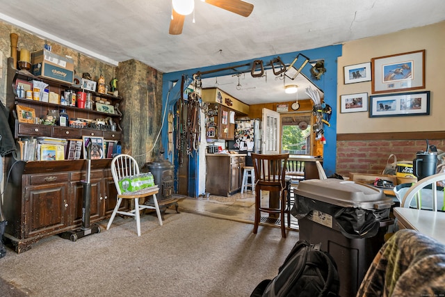 interior space with carpet and ceiling fan