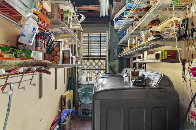 interior space featuring independent washer and dryer and tile patterned floors