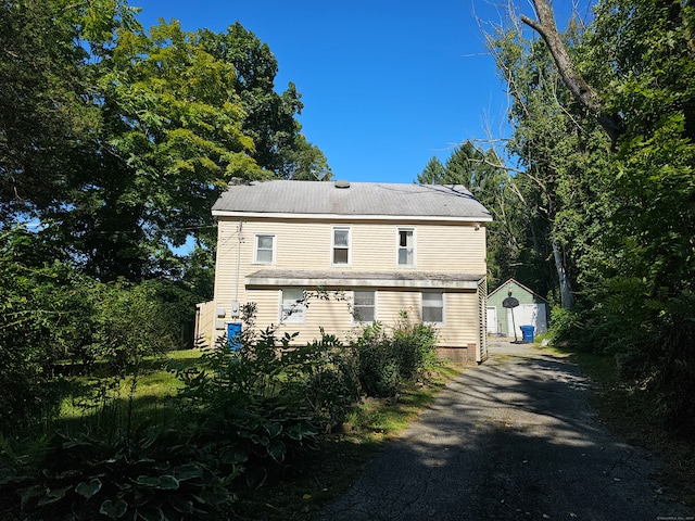 view of home's exterior featuring a storage shed