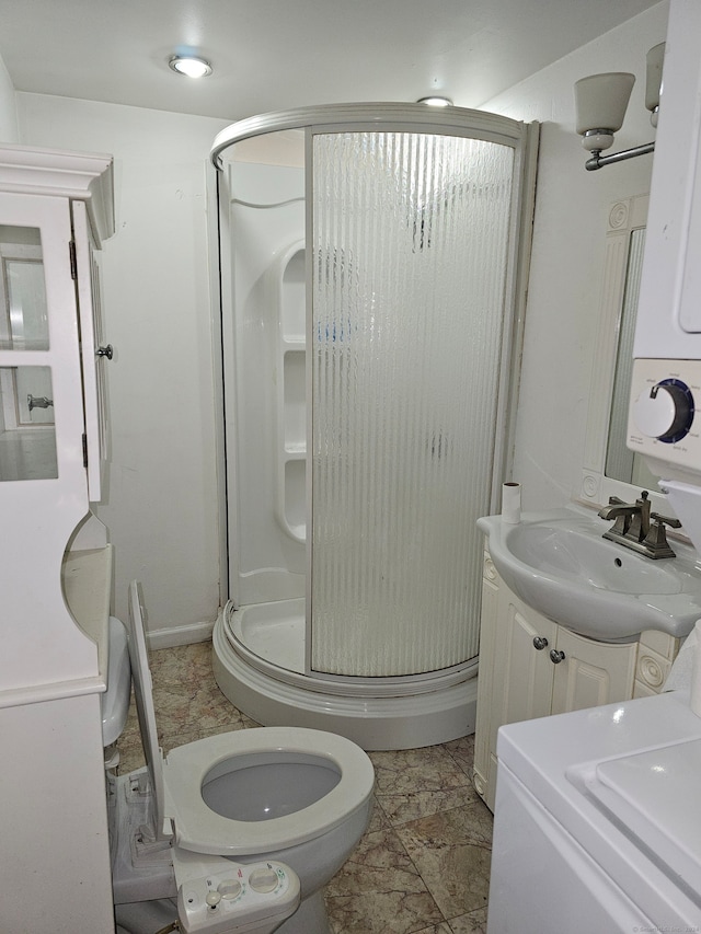 bathroom with vanity, toilet, and an enclosed shower