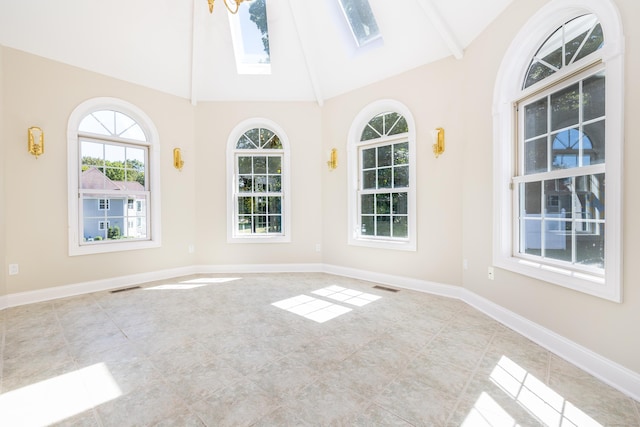 interior space featuring high vaulted ceiling and a skylight