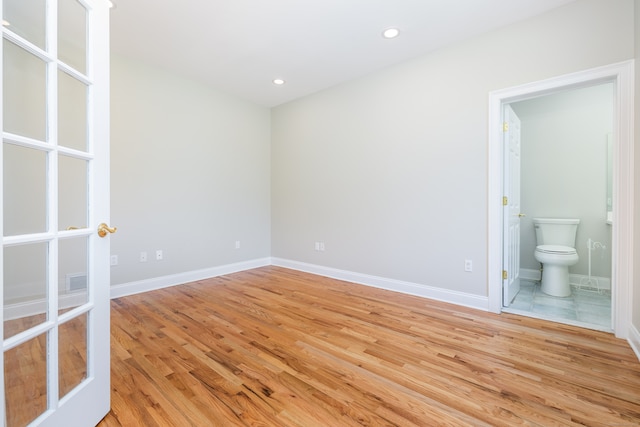 unfurnished room featuring light hardwood / wood-style floors