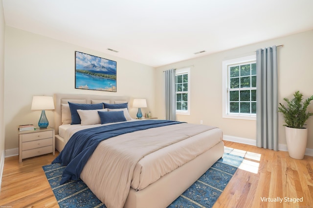 bedroom with wood-type flooring