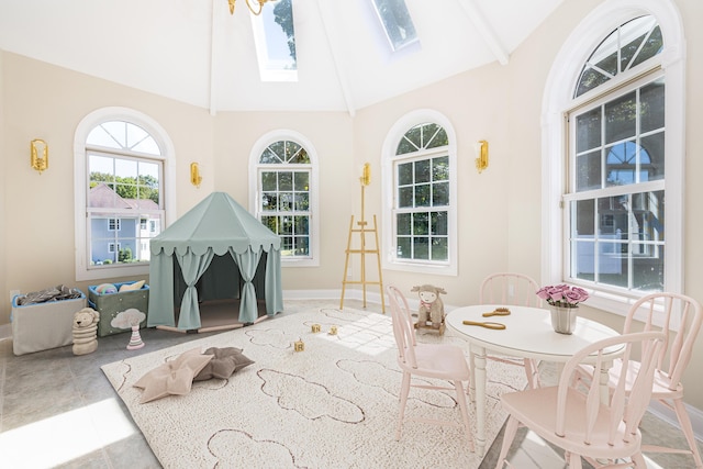 sunroom with vaulted ceiling with skylight