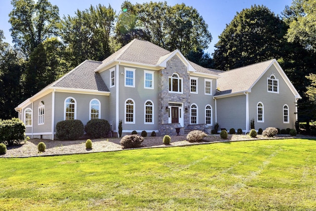 colonial-style house with a front yard