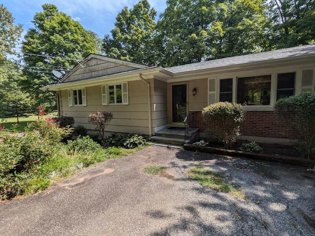 single story home with brick siding