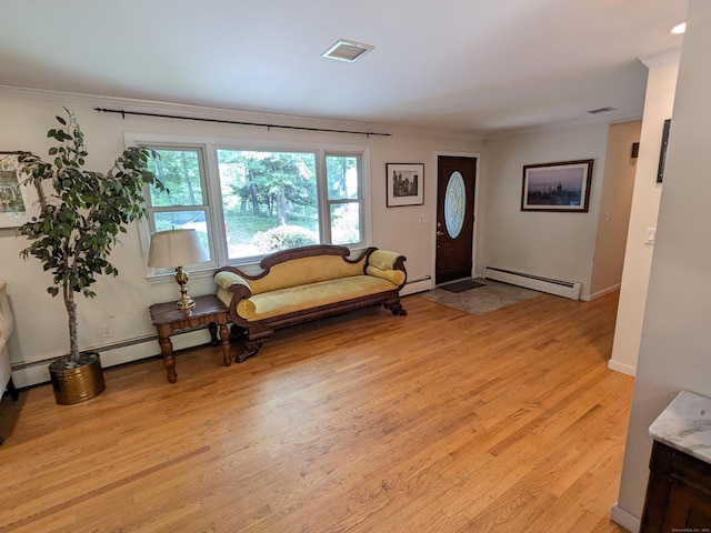 interior space with ornamental molding, visible vents, light wood finished floors, and a baseboard radiator