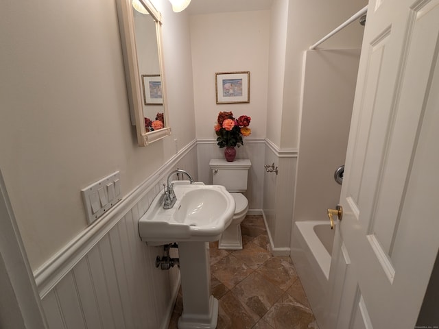 bathroom with toilet and shower / washtub combination