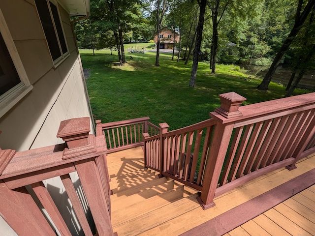 wooden terrace with a yard