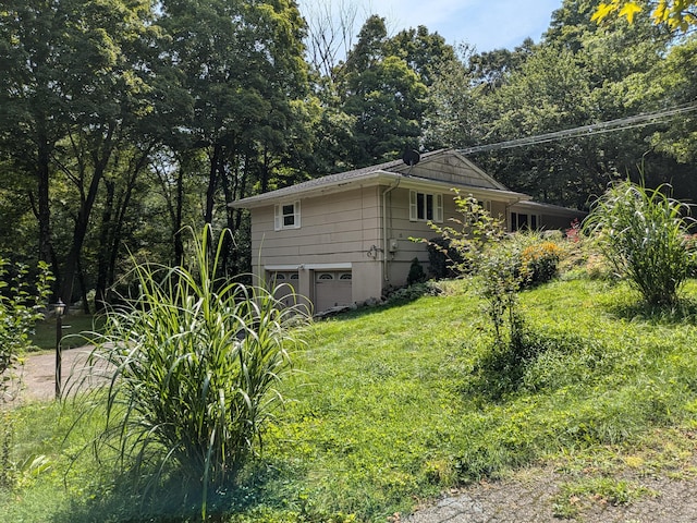 view of side of property with a garage