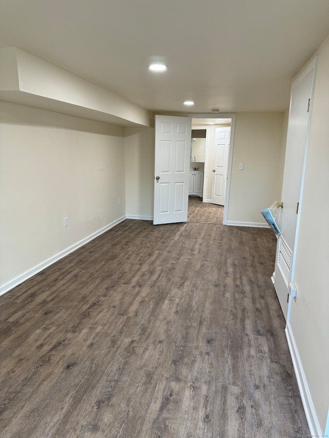 basement featuring dark hardwood / wood-style flooring