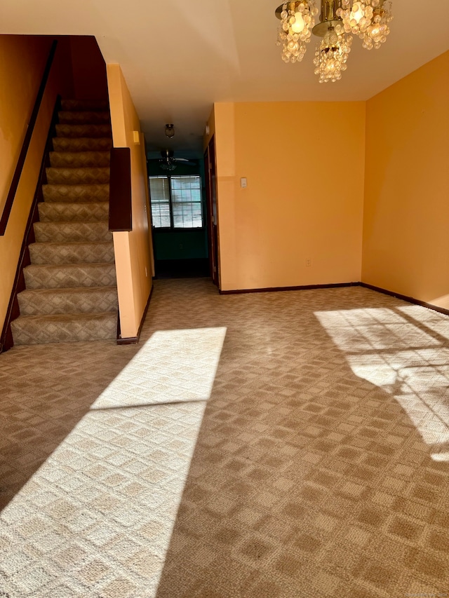 interior space featuring carpet floors and an inviting chandelier