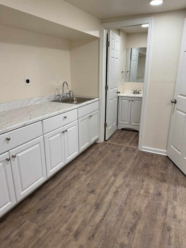 bathroom with vanity and wood-type flooring