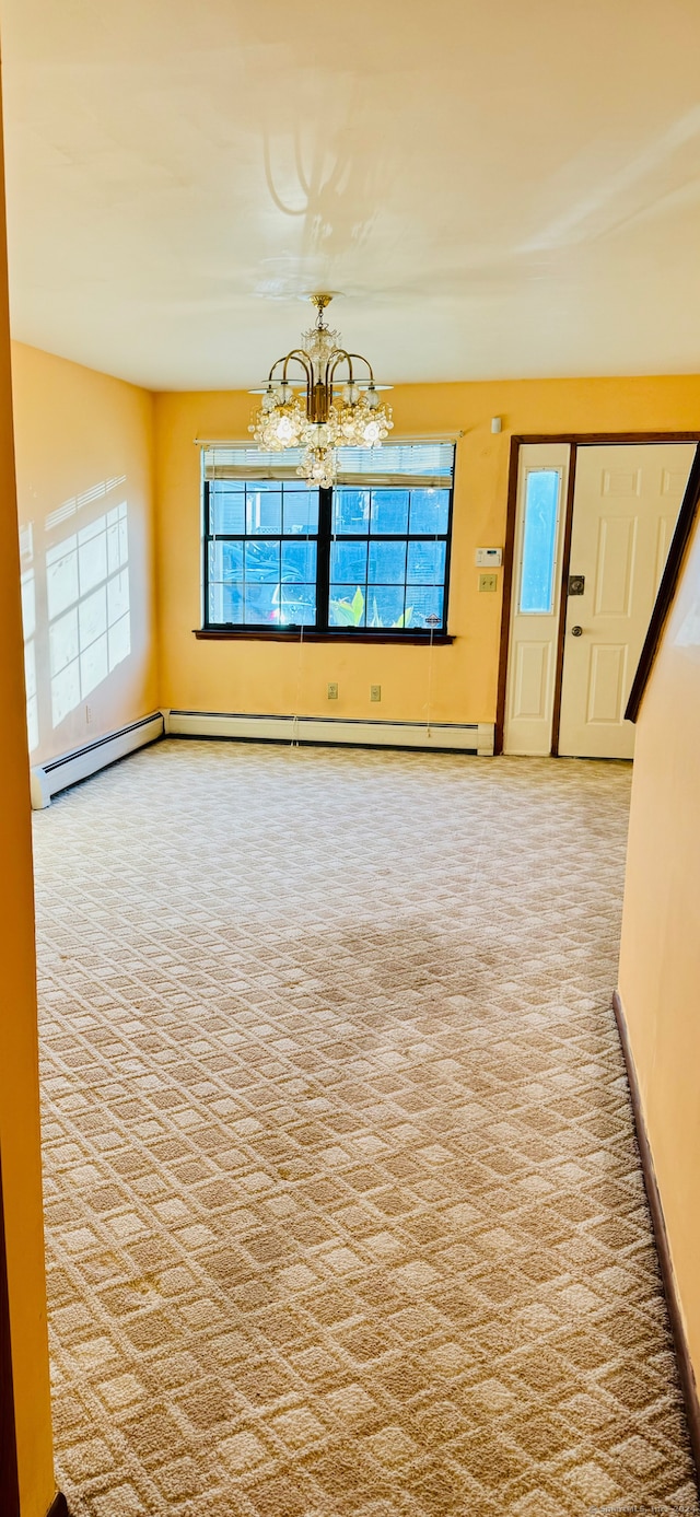 unfurnished living room featuring carpet floors and an inviting chandelier