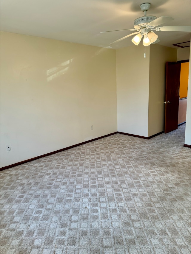 empty room featuring light carpet and ceiling fan