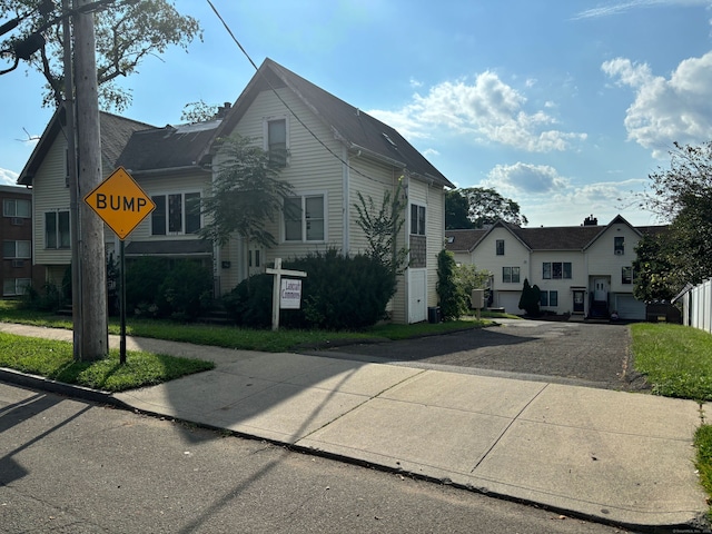 view of side of property featuring central AC unit