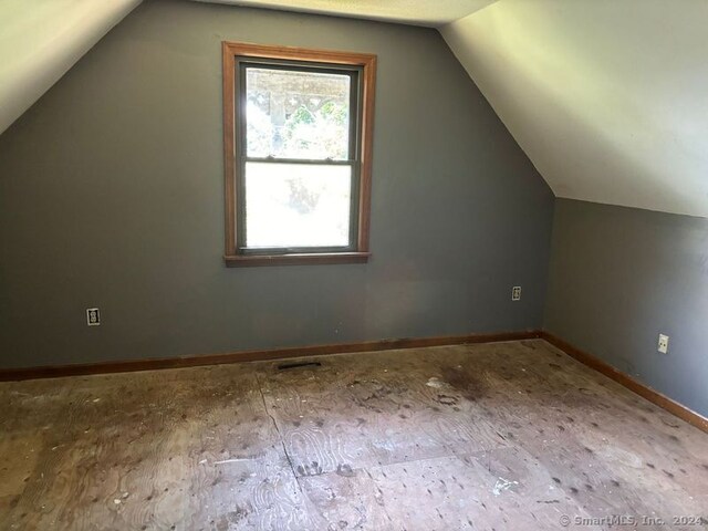 bonus room featuring lofted ceiling