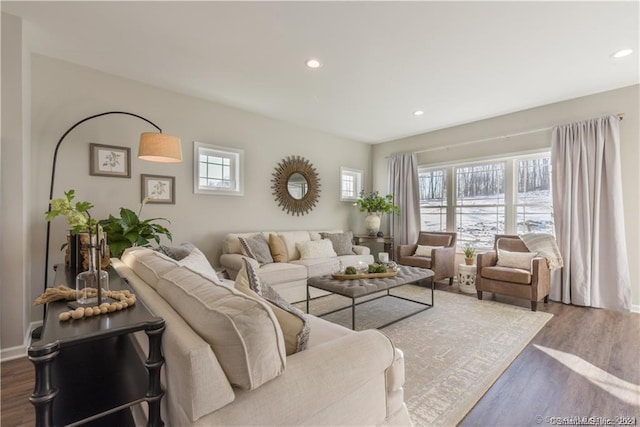 living area with recessed lighting and wood finished floors