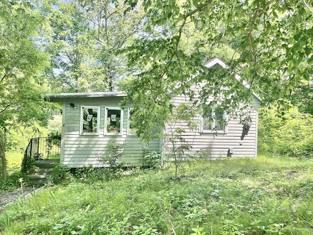 view of side of property featuring a deck