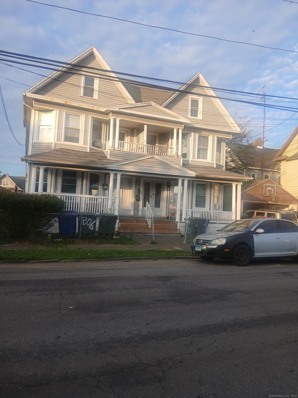 view of front of home with a balcony and covered porch