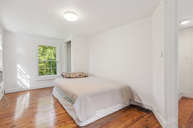 bedroom featuring hardwood / wood-style floors