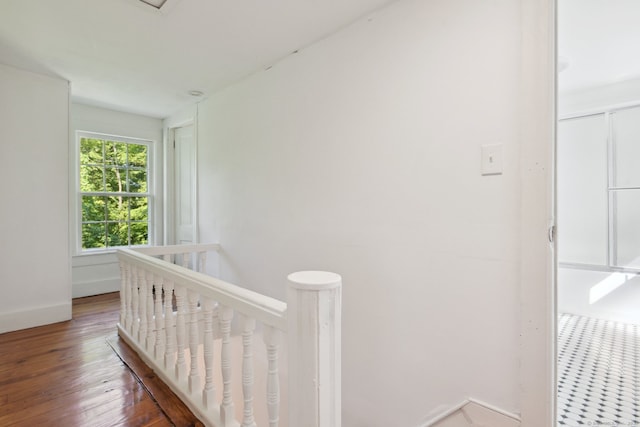 bedroom with a crib and wood-type flooring