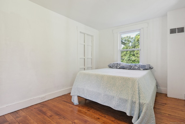 bedroom featuring hardwood / wood-style flooring