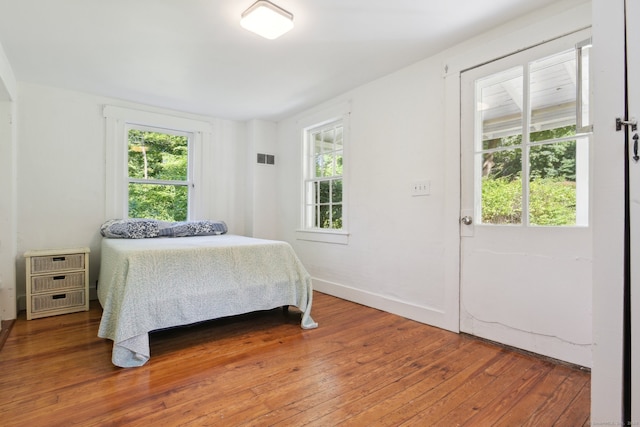 bedroom featuring wood-type flooring