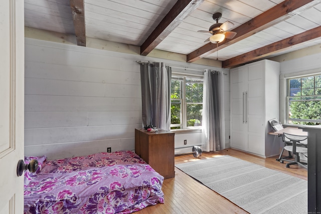 bedroom with multiple windows, ceiling fan, and light hardwood / wood-style flooring