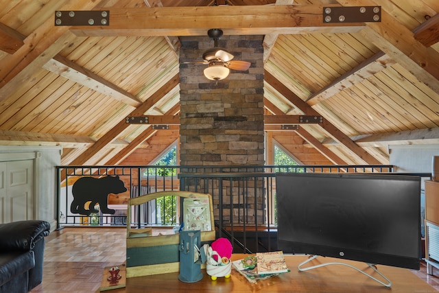 living room featuring lofted ceiling with beams, wood-type flooring, and ceiling fan