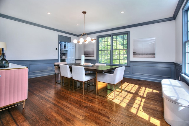 dining area with crown molding and dark wood-type flooring