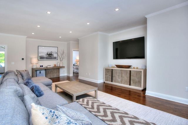 living room with dark wood-type flooring and ornamental molding