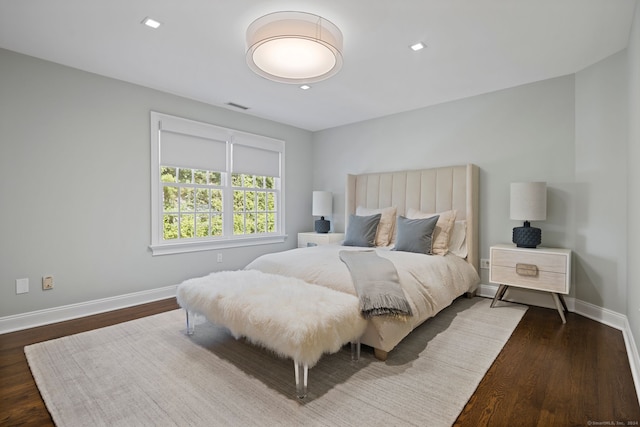 bedroom with dark wood-type flooring