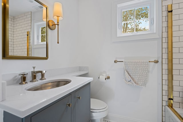 bathroom featuring vanity and toilet