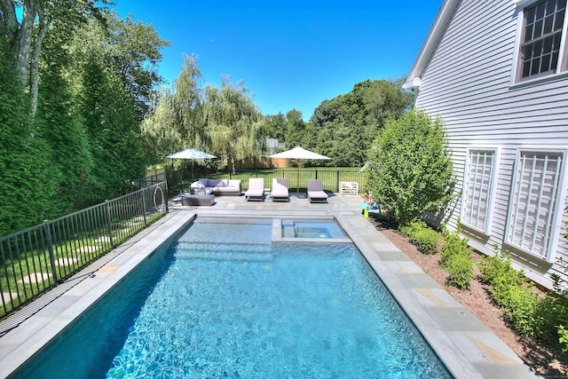 view of swimming pool featuring an outdoor living space, a patio area, and an in ground hot tub