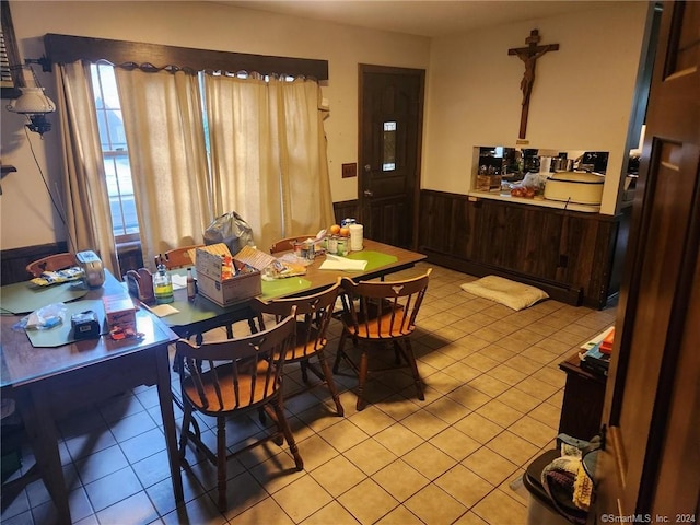 tiled dining area with wooden walls