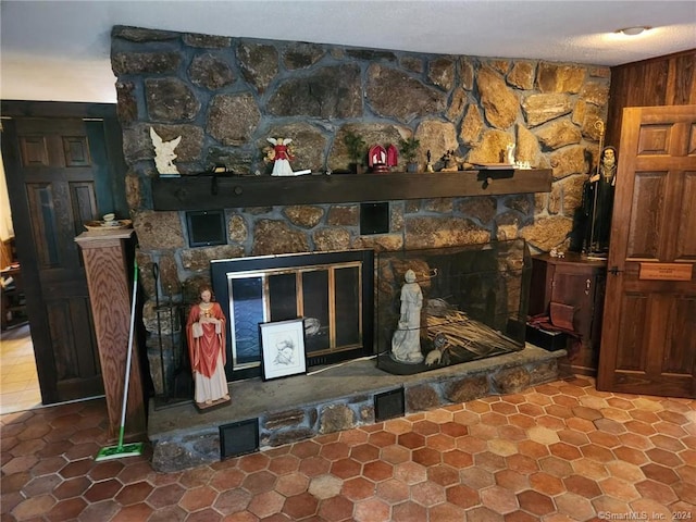 room details featuring a stone fireplace