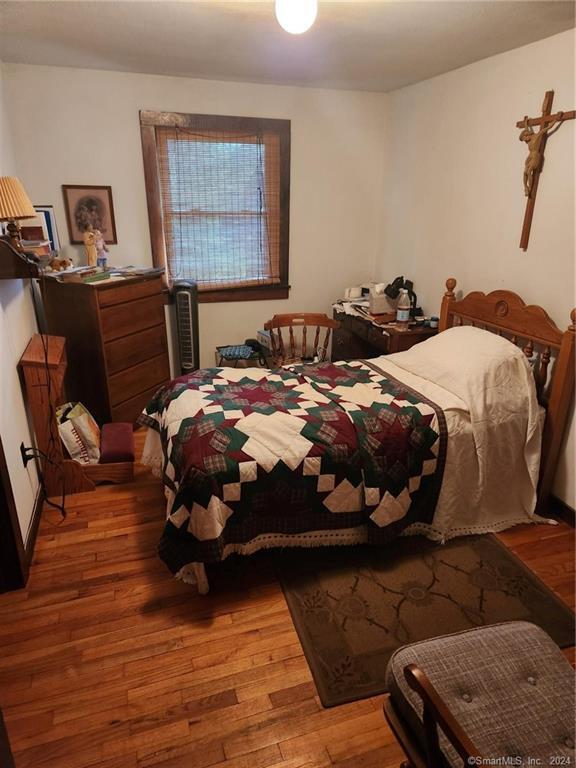 bedroom featuring wood-type flooring