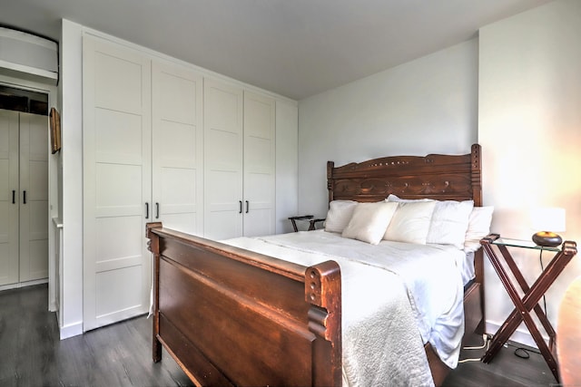 bedroom with dark wood-type flooring