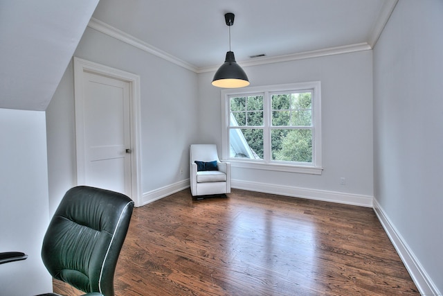 unfurnished room with visible vents, wood finished floors, baseboards, and ornamental molding