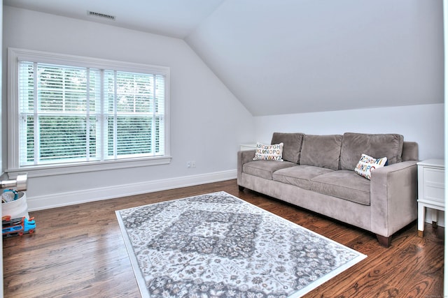 living room with visible vents, baseboards, lofted ceiling, and dark wood-style flooring