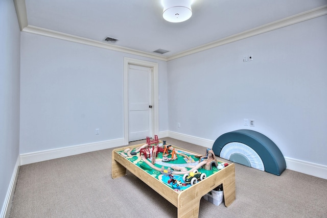 game room with visible vents, baseboards, ornamental molding, and carpet flooring