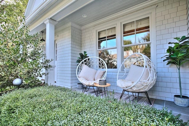 entrance to property featuring covered porch